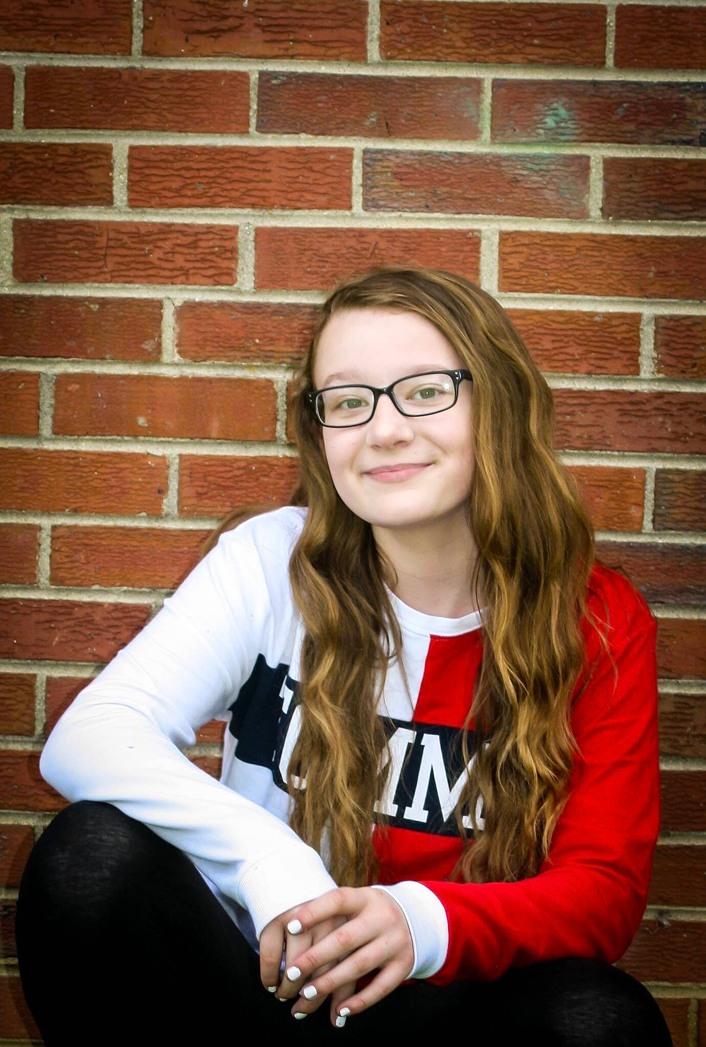 Kaydence joined the competition — help win amazing prizes! beauty, brick, brown_hair, eyewear, glasses, joy, long_hair, person, photo_shoot, photography, portrait, portrait_photography, red, sitting, smile