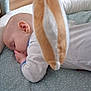 Eilidh joined the competition — help win amazing prizes! baby, sleeping, infant, cushion, plush_toy, basket, blanket, onesie, hand, face, head, soft, indoor, rest, peaceful, child, nursery, toy, closeup, comfort