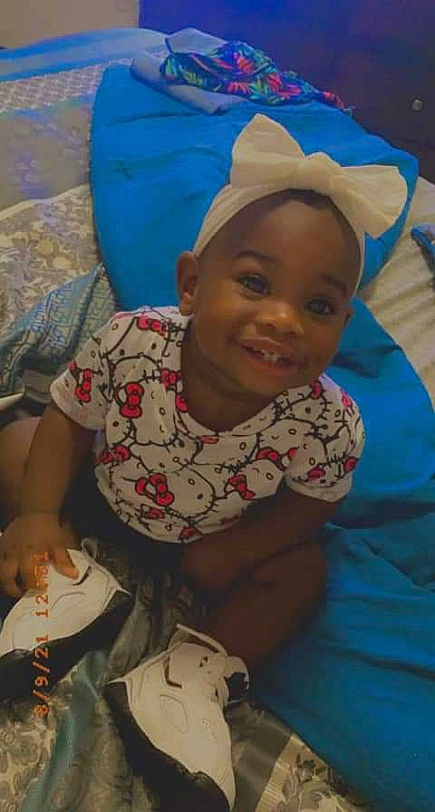 Allison is registered to the contest to win money with this photo: adaptation, baby, cap, cheek, child, comfort, fun, happy, joy, leisure, linens, mouth, pattern, person, room, sitting, skin, smile, t_shirt, textile