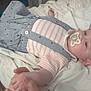 Spencer is registered to the contest to win money with this photo: baby, bed, blanket, child, cute, face, hand, head, indoor, infant, newborn, pacifier, peaceful, person, resting, skin, sleeping, soft_lighting, striped_clothing, suspenders