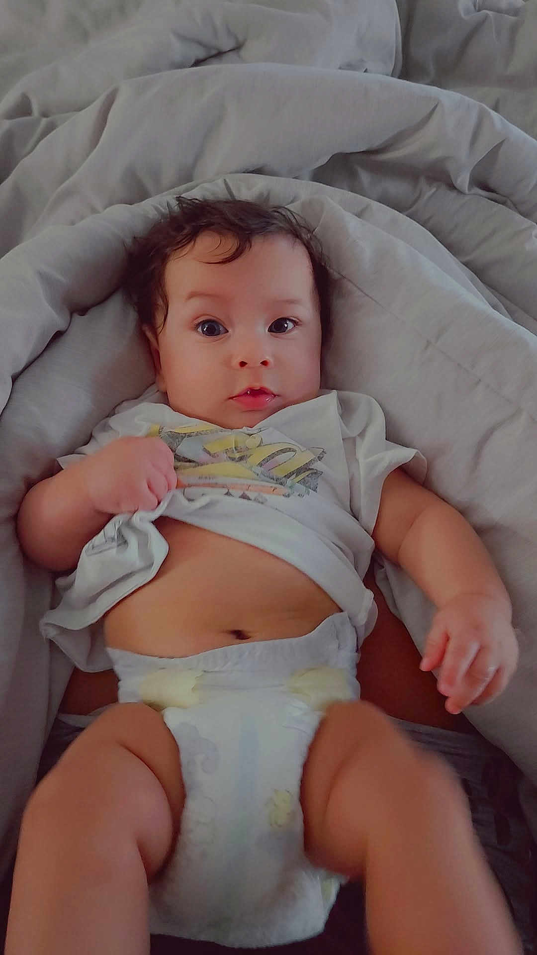Kairann is registered to the contest to win money with this photo: baby, infant, diaper, clothing, blanket, lying_down, cute, face, expression, skin, hand, foot, soft, comfort, indoors, child, person, young, toddler, casual