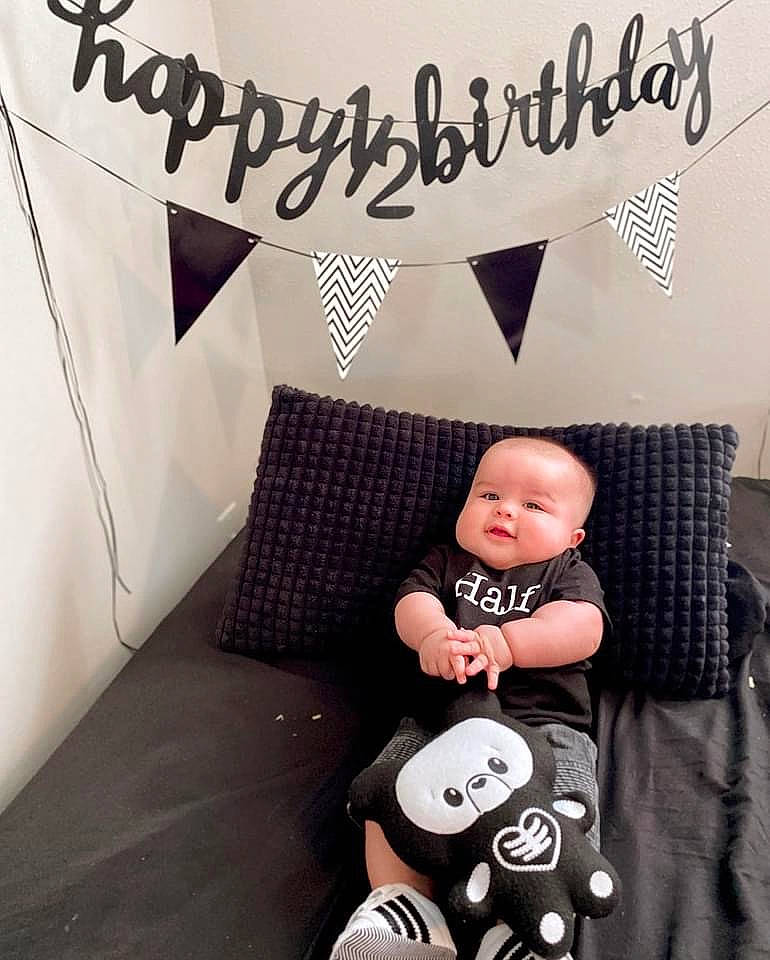 Izaiah joined the competition — help win amazing prizes! baby, baby_products, baby_toddler_clothing, bedding, comfort, couch, design, font, happy, linens, person, pillow, product, room, sitting, sleeve, stuffed_toy, t_shirt, throw_pillow, toddler