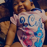 Icelynn Shawnta is registered to the contest to win money with this photo: baby, infant, smiling, headband, onesie, blanket, cute, chubby_cheeks, portrait, indoor, sitting, fabric, pattern, cartoon_print, legs, arm, hand, face, eyes, lips