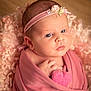 newborn, baby, infant, pink, blanket, headband, heart, soft_texture, wrapped, portrait, cute, small_hand, sleepy, face, closeup, skin, cozy, warm, resting, peaceful