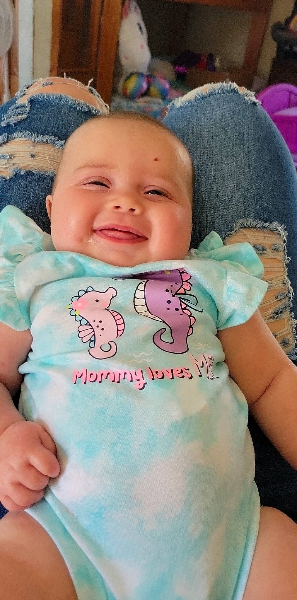 Zalaney is registered to the contest to win money with this photo: aqua, azure, baby, baby_toddler_clothing, blue, cheek, finger, green, happy, head, human, joy, mouth, organ, person, pink, product, skin, sleeve, smile