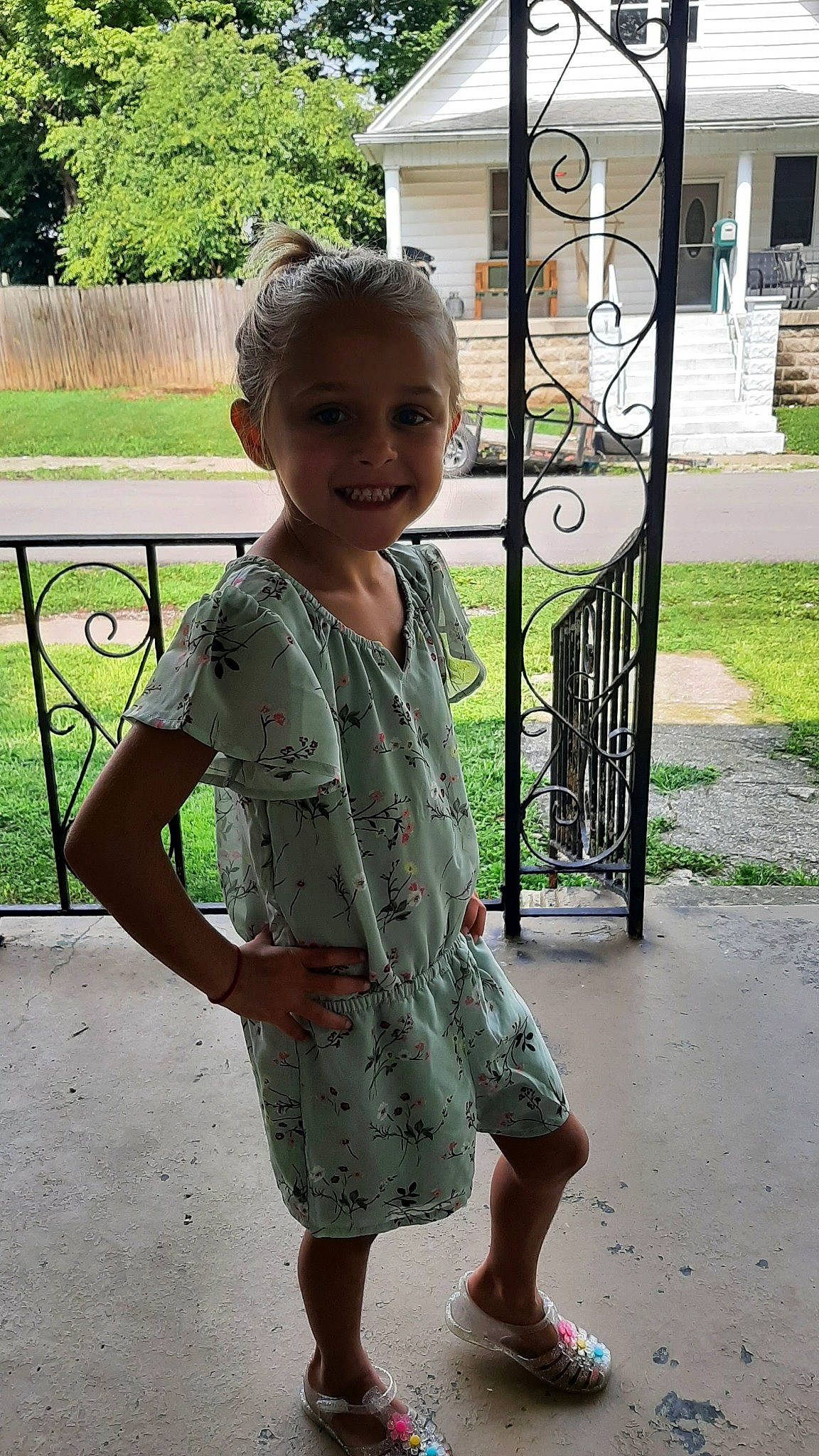 Araya joined the competition — help win amazing prizes! baby_toddler_clothing, botany, child, day_dress, door, grass, happy, human_leg, joy, leisure, one_piece_garment, pattern, person, plant, sandal, skin, sleeve, smile, standing, toddler