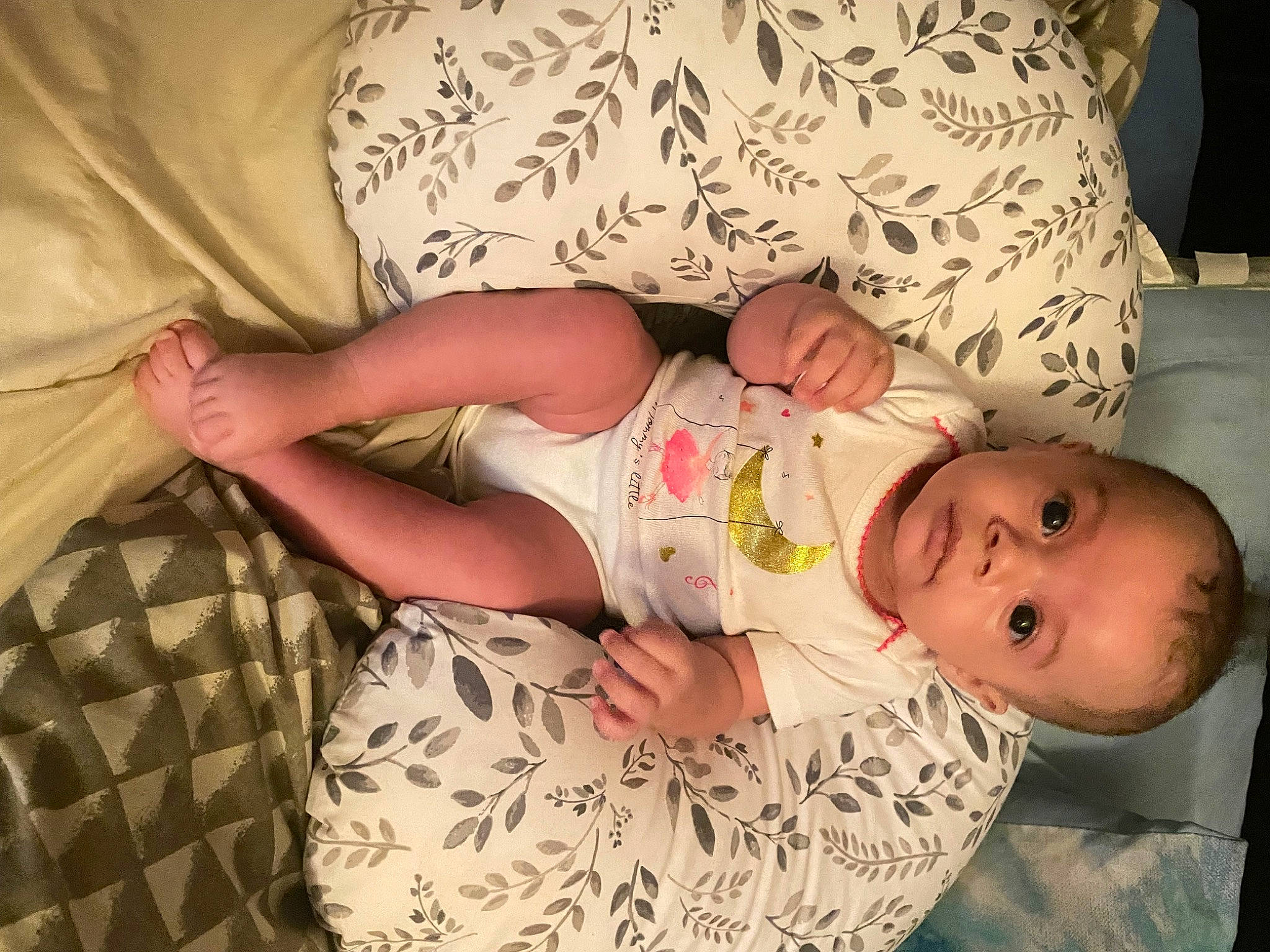 Raziyah joined the competition — help win amazing prizes! abdomen, baby, baby_products, baby_toddler_clothing, cheek, child, comfort, couch, finger, hand, happy, human_body, linens, pattern, person, room, sitting, skin, sleeve, textile