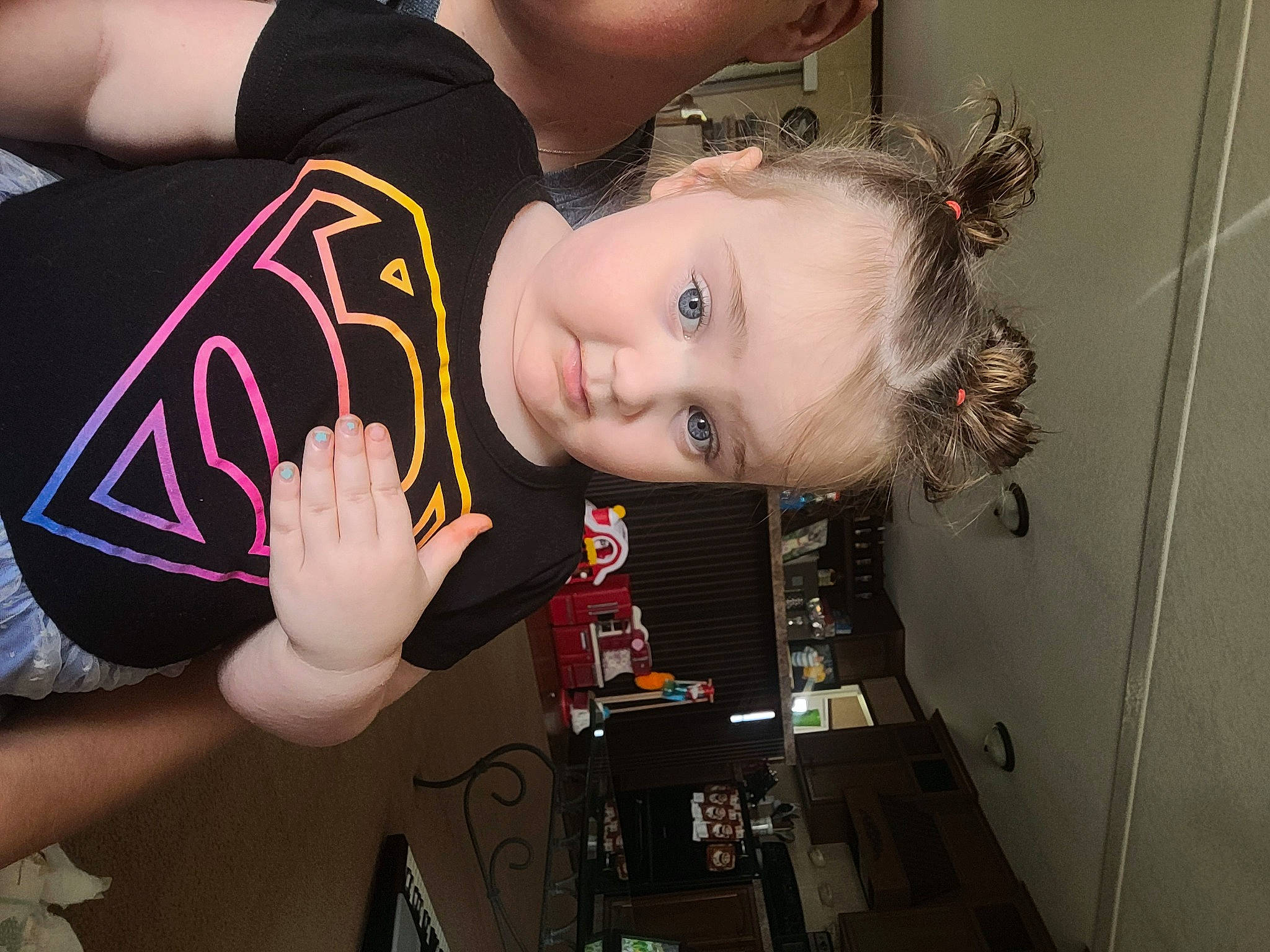 Mckenna is registered to the contest to win money with this photo: arm, black_hair, child, elbow, eyelash, fashion_accessory, flash_photography, fun, happy, human_leg, nail, pattern, person, room, toddler, wrist