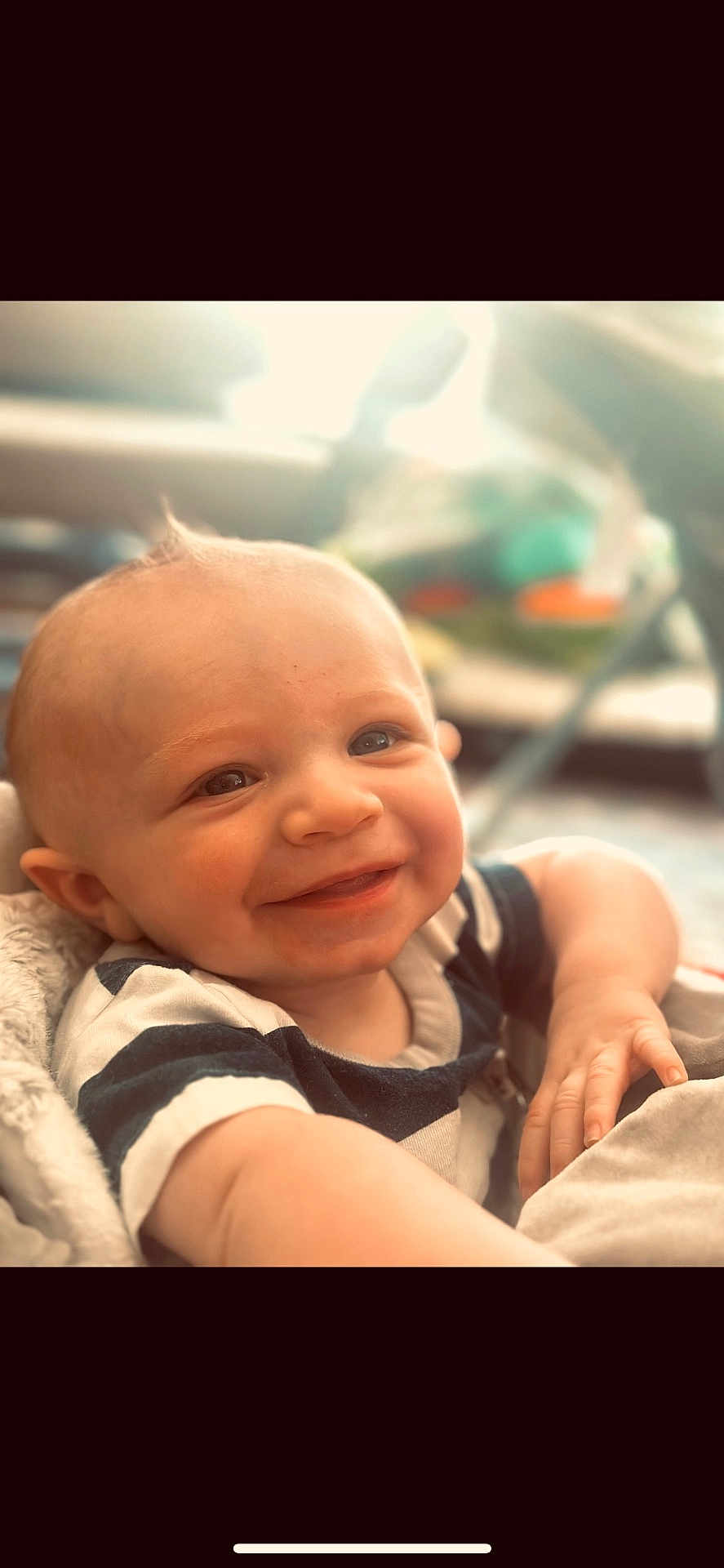 Ryder joined the competition — help win amazing prizes! baby, child, smiling, face, arm, hand, shirt, striped_shirt, indoor, cozy, soft_light, closeup, portrait, cute, happy, infant, skin, expression, person, young