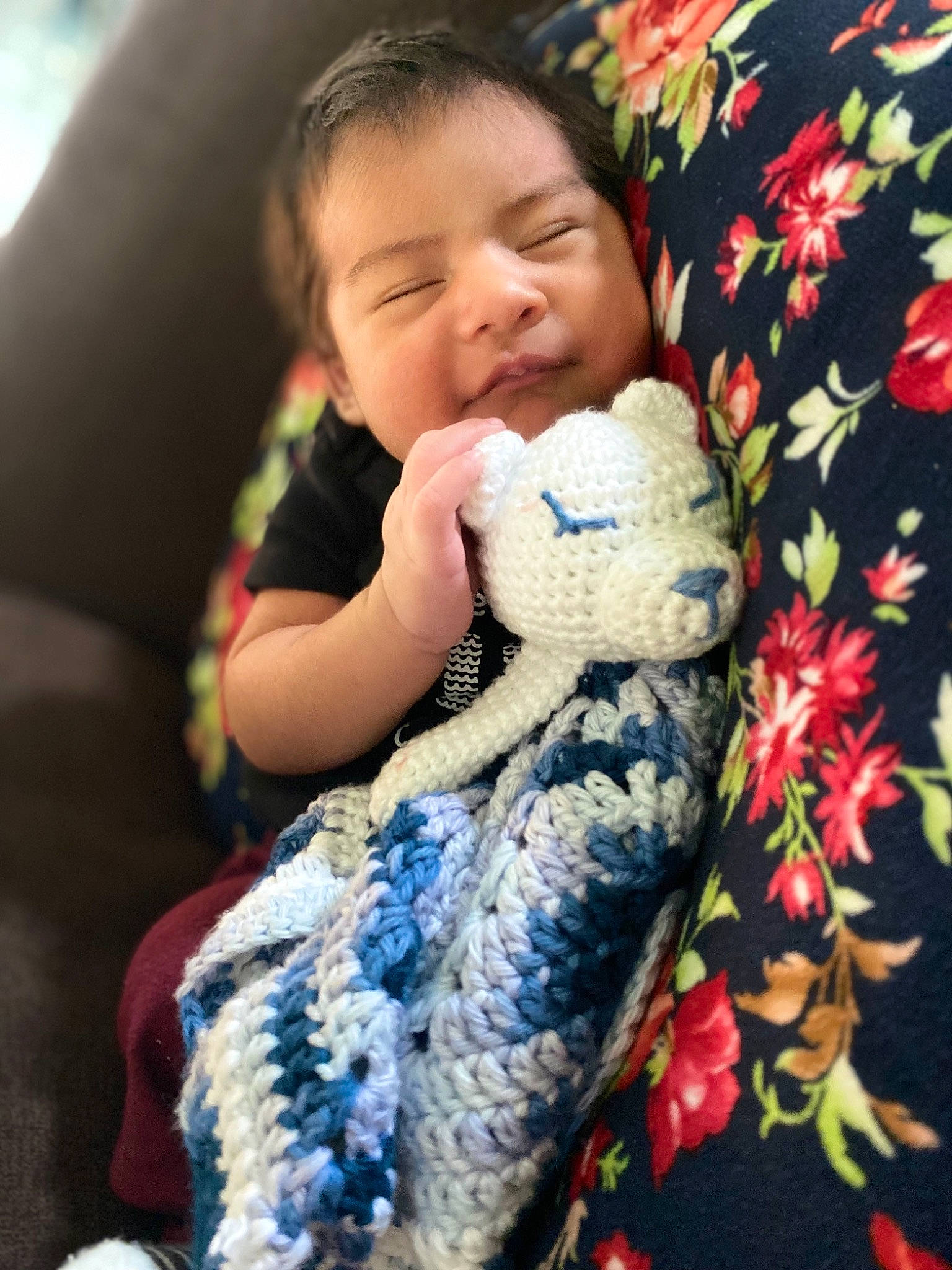 Amar is registered to the contest to win money with this photo: arm, baby, baby_toddler_clothing, child, comfort, eye, finger, fur, hand, happy, linens, mammal, pattern, person, sitting, sleeve, smile, stuffed_toy, t_shirt, toddler