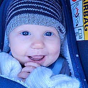 Charly participe au concours pour gagner de l'argent avec cette photo : baby, child, smiling, hat, knit_hat, blue_eyes, car_seat, blanket, winter_clothing, cozy, cute, portrait, face, infant, happy, warm, closeup, person, seatbelt, star_pattern