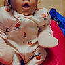 Demyah joined the competition — help win amazing prizes! baby, bow, child, cozy, cute, expression, happy, headband, indoor, infant, mittens, onesie, orange_prints, person, portrait, red_surface, small, smiling, socks, wooden_floor