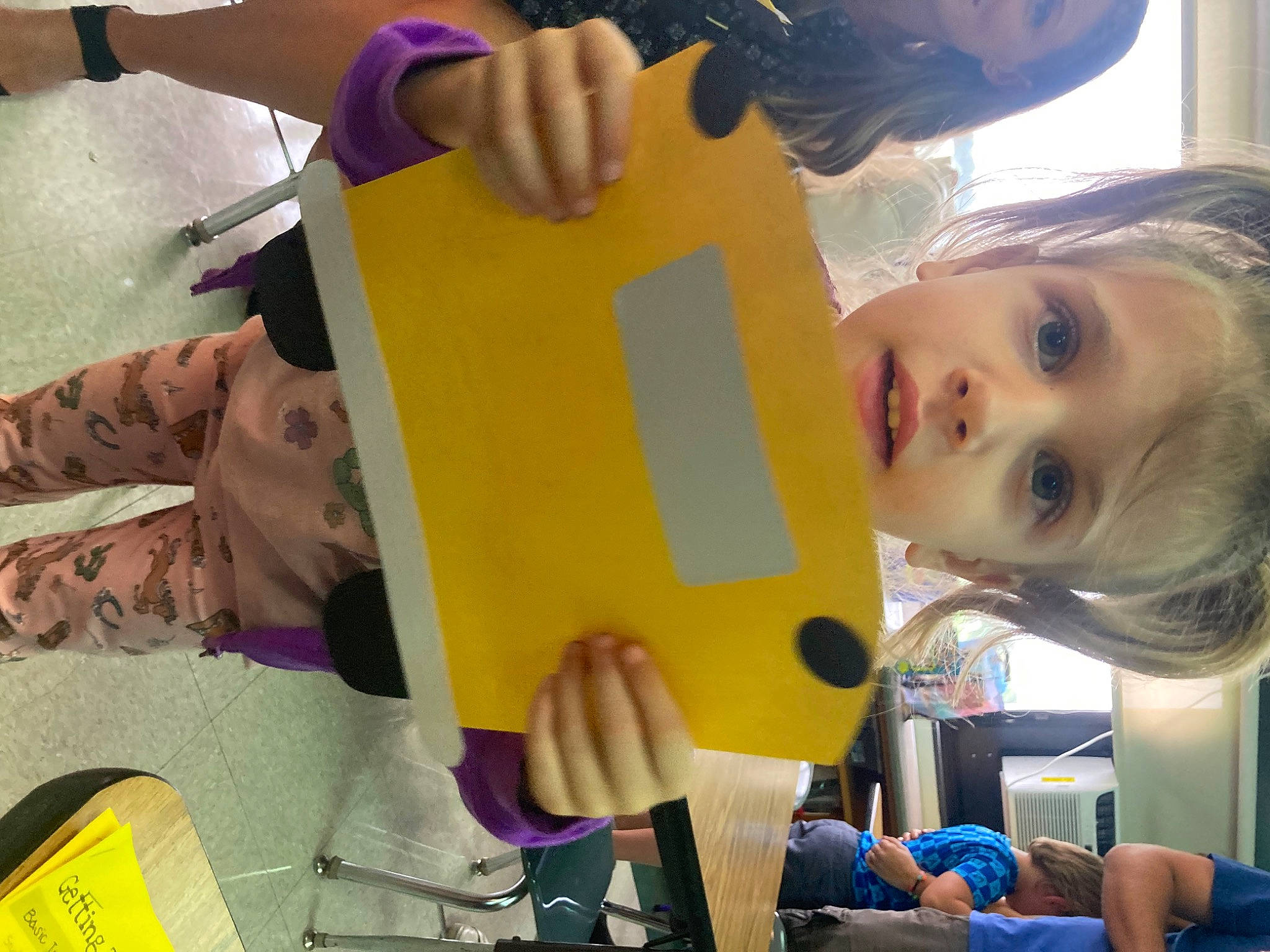 Kalie is registered to the contest to win money with this photo: chair, child, eyelash, fun, happy, kindergarten, leisure, person, plastic, play, room, t_shirt, toddler, visual_arts, yellow