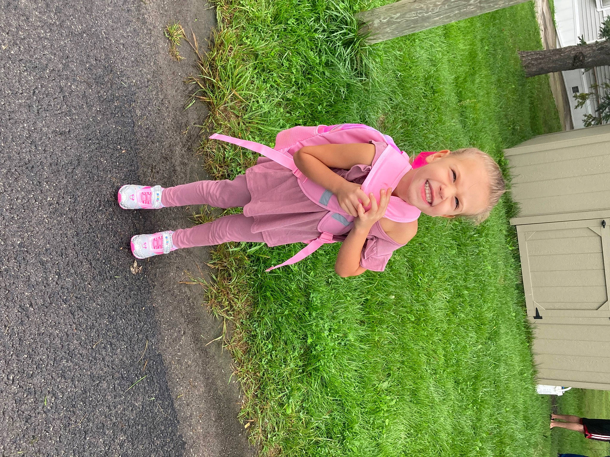 Kalie is registered to the contest to win money with this photo: child, dress, fun, garden, grass, green, happy, joy, landscape, lawn, leisure, magenta, people_in_nature, person, plant, recreation, shadow, shrub, toddler, tree