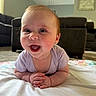 Lilith is registered to the contest to win money with this photo: baby, smiling, infant, happy, face, hands, lying_down, blanket, indoors, living_room, couch, carpet, cute, portrait, child, young, skin, eyelashes, head, clothing