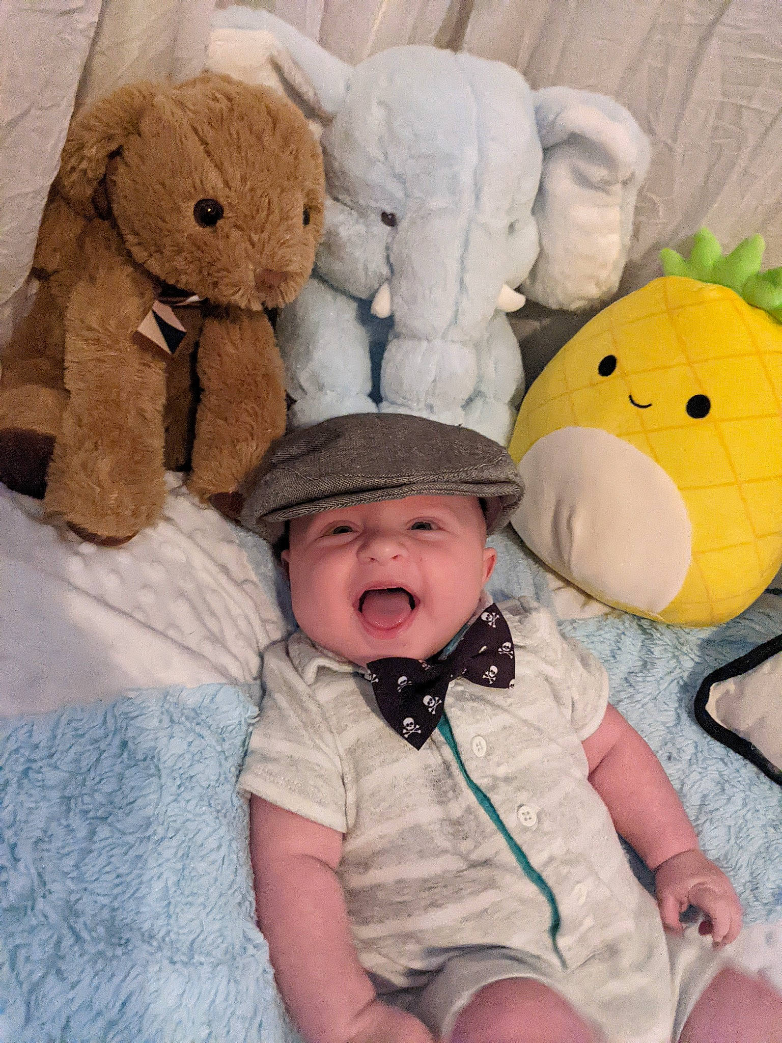 Crimson is registered to the contest to win money with this photo: baby, baby_products, baby_toddler_clothing, bed, child, comfort, fun, happy, headgear, headwear, linens, person, plush, product, room, smile, stuffed_toy, textile, toddler, toy
