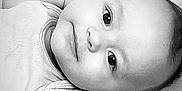 Esmé-Ivy joined the competition — help win amazing prizes! baby, infant, face, eyes, arm, bedding, blanket, plush_toy, soft_toy, sleepwear, portrait, monochrome, black_and_white, child, cute, lying_down, closeup, young, expression, indoors