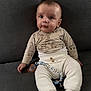 Sohan participe au concours pour gagner de l'argent avec cette photo : baby, beads, child, couch, cute, eyes, face, giraffe_print, indoor, infant, knit_pants, long_sleeve_shirt, neutral_background, pacifier, pacifier_clip, photography, portrait, sitting, socks, sofa