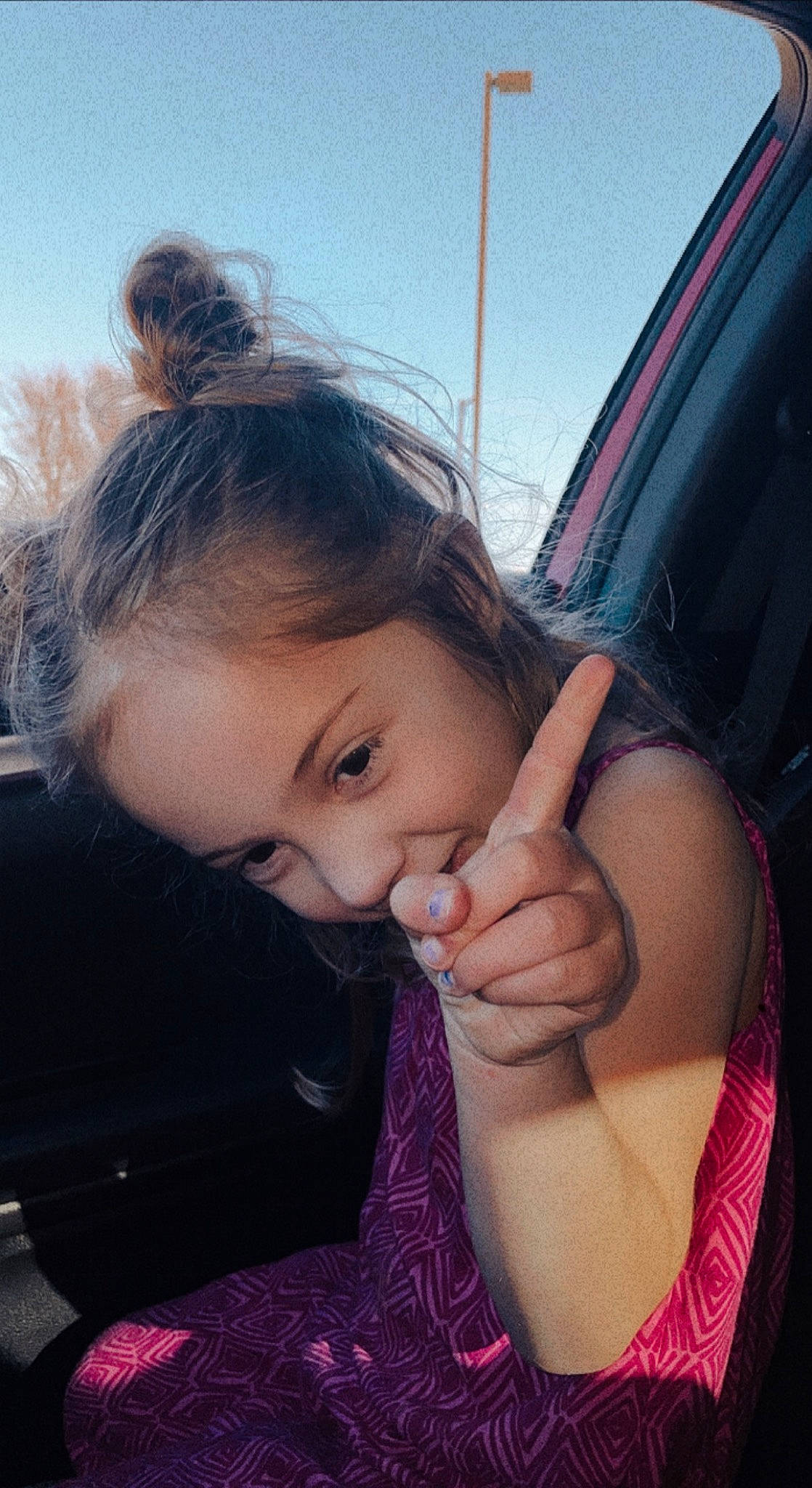 Payton joined the competition — help win amazing prizes! black_hair, car_seat, eyebrow, eyelash, finger, gesture, grass, happy, iris, lip, long_hair, neck, person, plant, shoulder, skin, sky, thumb, toddler, tree