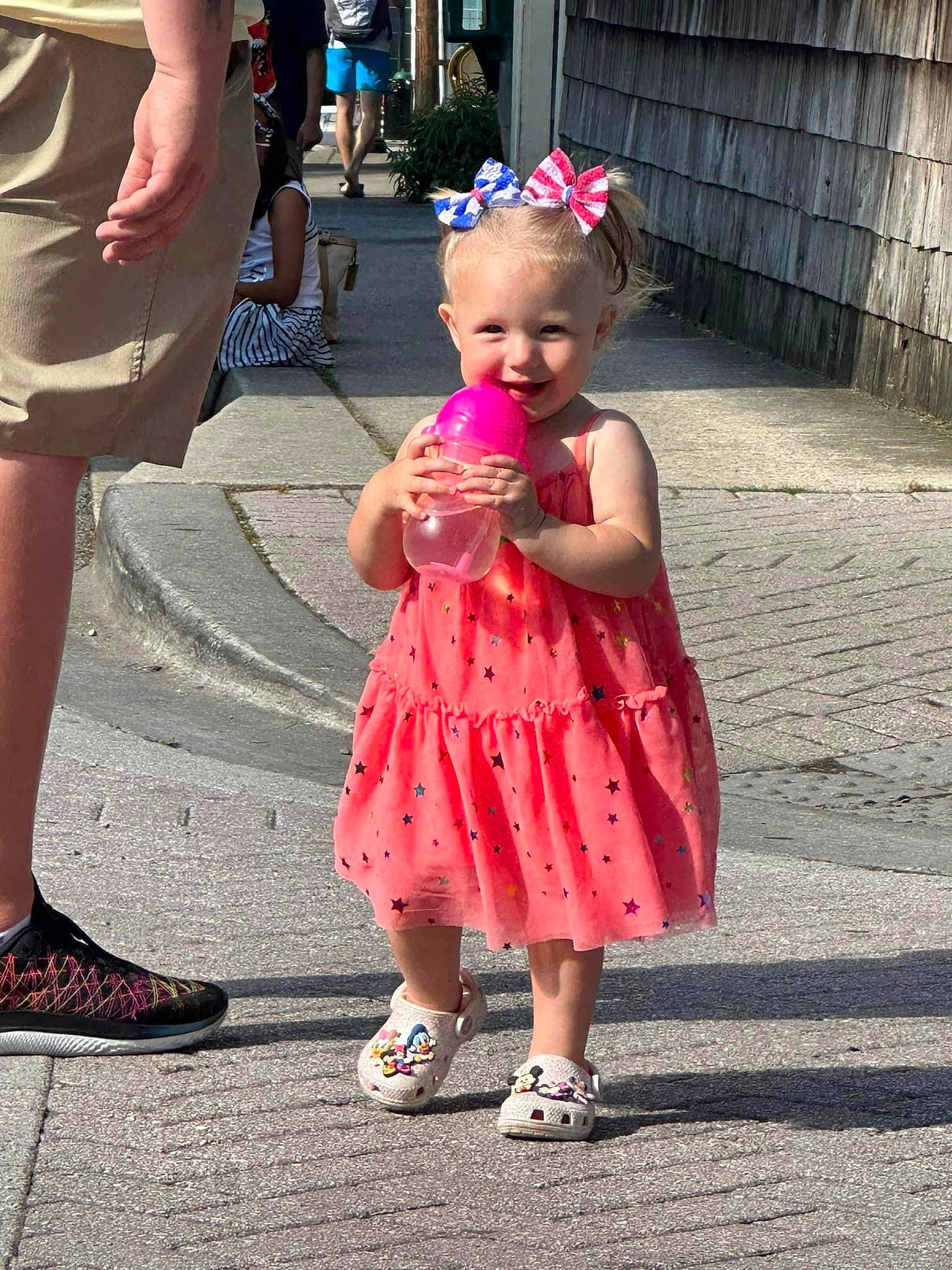 Amerah joined the competition — help win amazing prizes! asphalt, child, dress, event, eyewear, footwear, fun, gesture, happy, human_leg, joy, leg, person, pink, sandal, shoe, shorts, smile, summer, thigh