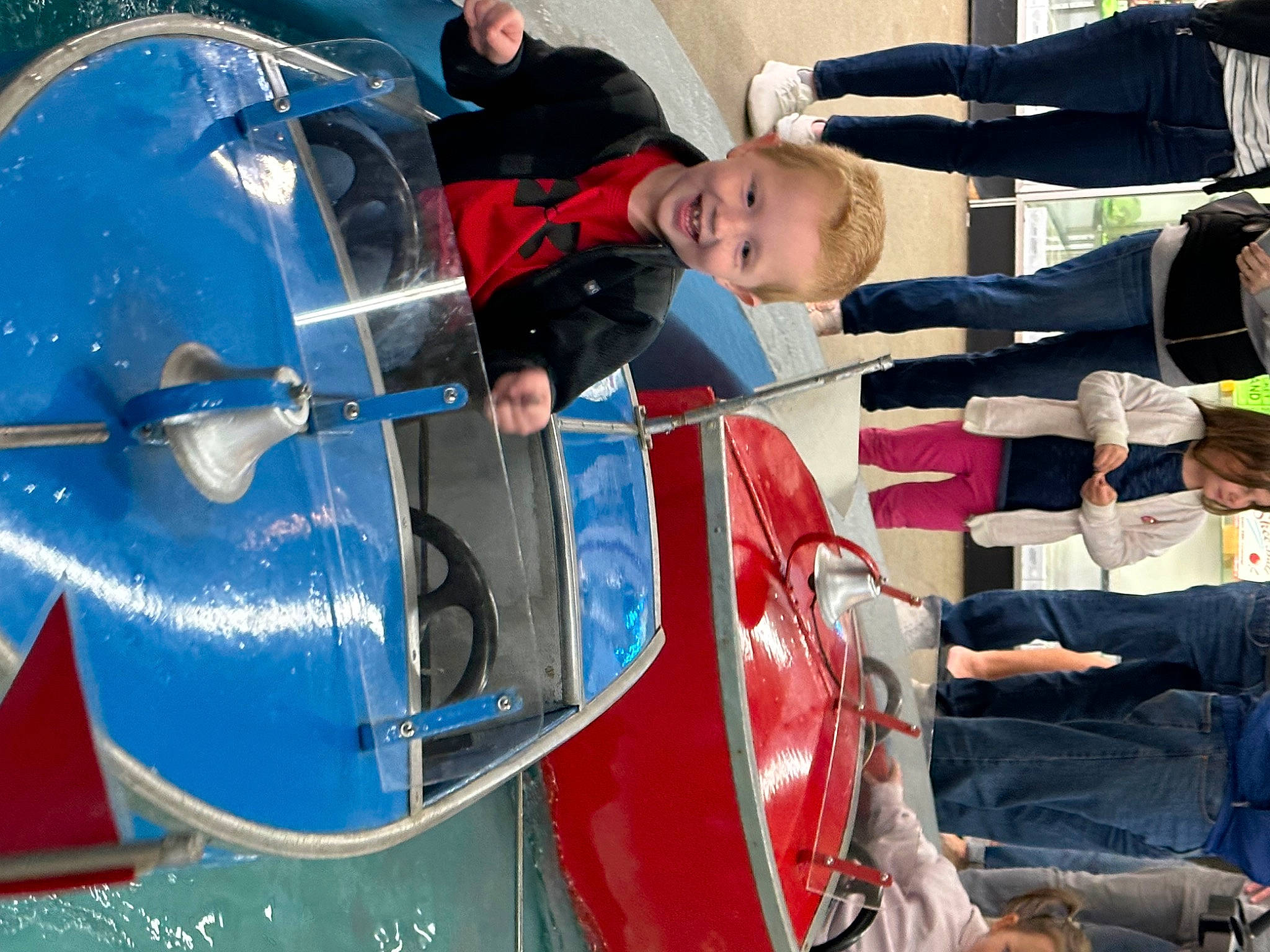 Andrew joined the competition — help win amazing prizes! auto_part, automotive_exterior, automotive_wheel_system, bumper, drum, electric_blue, event, fun, gesture, hood, joy, leisure, motor_vehicle, person, personal_protective_equipment, playground, recreation, smile, toddler, transport