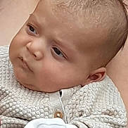 Wilson joined the competition — help win amazing prizes! baby, button, closeup, clothing, curious, cute, ear, expression, face, head, indoors, infant, light, person, portrait, puzzled, skin, soft_lighting, texture, young_child