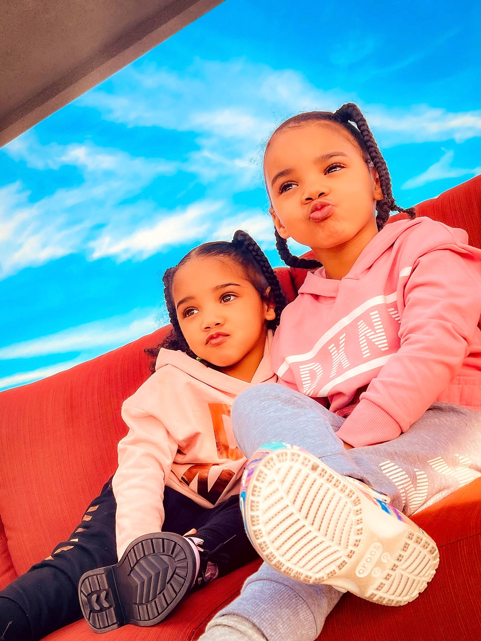 Aryn is registered to the contest to win money with this photo: azure, blue, cloud, comfort, electric_blue, facial_expression, flash_photography, fun, happy, human_body, human_leg, lap, leisure, people_in_nature, person, recreation, shoe, sky, sneakers, toddler