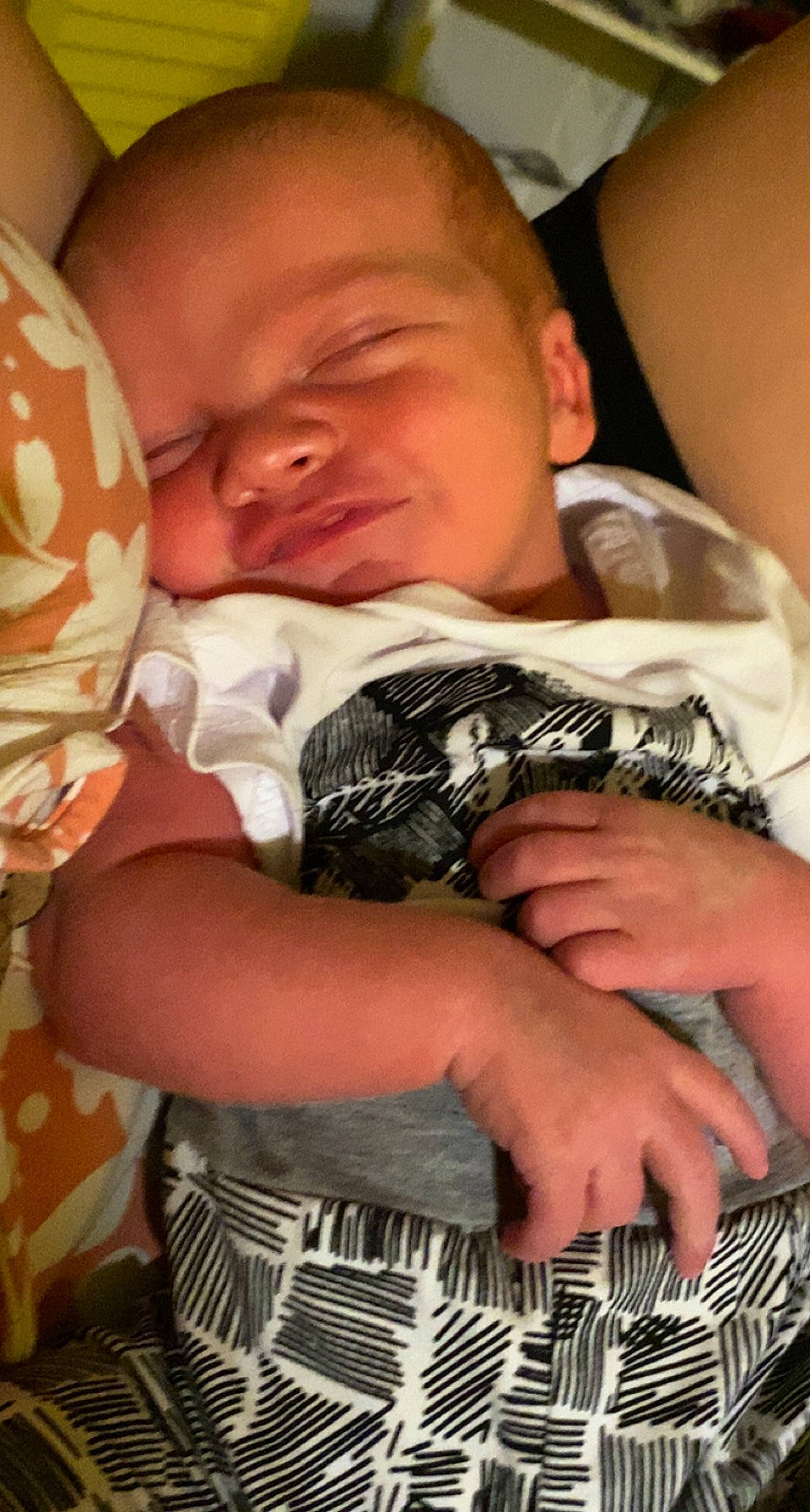 Legend is registered to the contest to win money with this photo: baby, baby_toddler_clothing, cheek, child, comfort, facial_expression, finger, hand, happy, linens, mouth, muscle, nail, organ, pattern, person, skin, textile, thumb, toddler