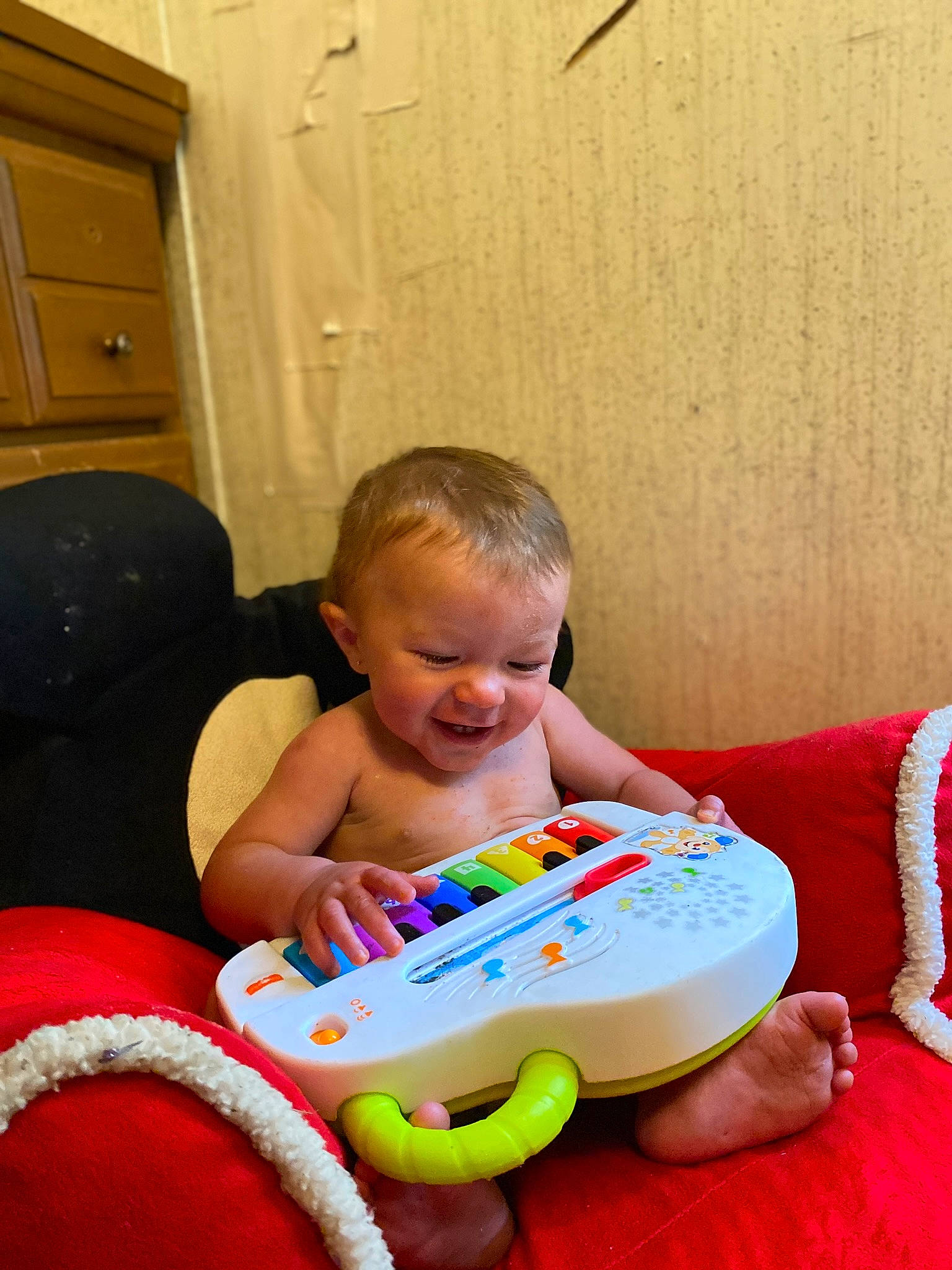 Xander is registered to the contest to win money with this photo: baby, baby_playing_with_toys, baby_toddler_clothing, cabinetry, carmine, child, comfort, cupboard, drawer, event, fun, gadget, happy, holiday, lap, person, play, room, sharing, sitting
