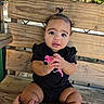 baby, child, infant, portrait, sitting, bench, wood, outdoor, park, nature, trees, greenery, sunlight, black_clothing, romper, hands, smiling, curious, face, adult_hand