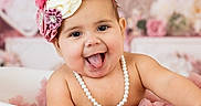 Penelope is registered to the contest to win money with this photo: baby, baby_girl, child, cute, decor, floral, flower_headband, happy, head, indoors, infant, pearl_necklace, pink, playful, portrait, sitting, skin, smiling, tongue_out, tub