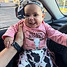 Penelope joined the competition — help win amazing prizes! baby, child, smile, pink_shirt, cow_print, headband, car_interior, hand, happy, portrait, clothing, infant, face, seat, window, accessory, cute, person, sitting, young_child