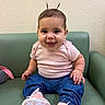 Penelope joined the competition — help win amazing prizes! baby, child, smiling, sitting, chair, portrait, indoors, pink_shirt, blue_jeans, pink_shoes, sneakers, pigtails, earrings, green_chair, wall, wall_decor, happy, infant, fashion, closeup