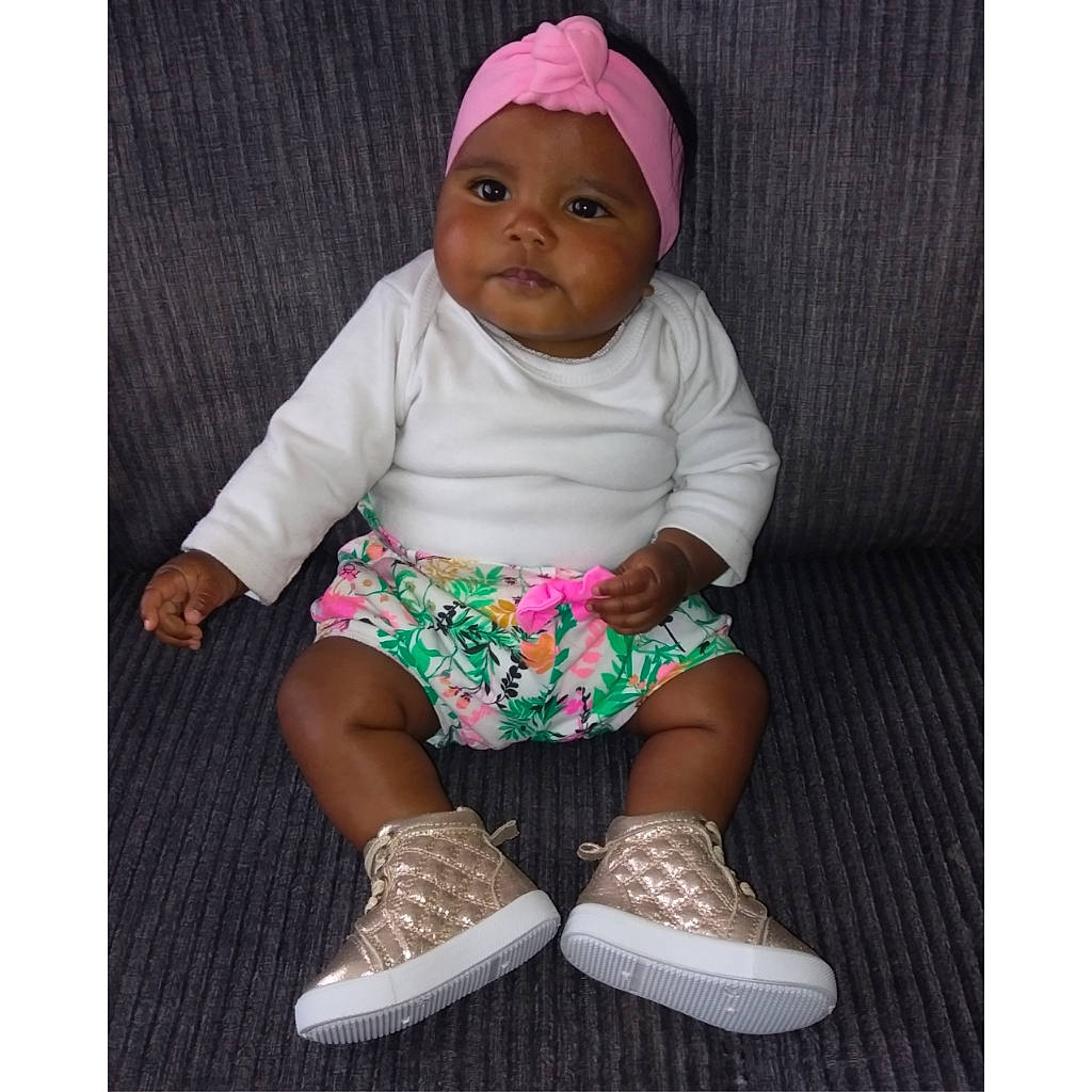 Kamiya is registered to the contest to win money with this photo: baby, baby_products, baby_toddler_clothing, beige, child, footwear, headgear, headwear, magenta, person, pink, play, product, shoe, sitting, toddler, turquoise