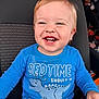 toddler, child, smile, blue_shirt, dinosaur, car_seat, happy, face, teeth, clothing, messy, seat, person, cute, young_child, indoor, portrait, baby, joyful, casual