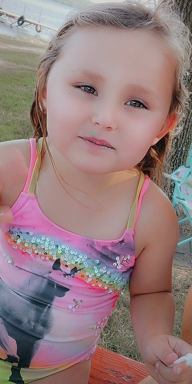 Adaline is registered to the contest to win money with this photo: active_tank, chest, cool, eyelash, face, facial_expression, fun, grass, happy, leisure, lip, magenta, mouth, neck, people_in_nature, person, pink, shoulder, skin, sleeveless_shirt