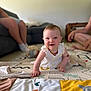 adult, baby, carpet, casual, child, crawling, cute, floor, furniture, happy, home, indoor, infant, living_room, person, play_mat, smiling, socks, toy, white_dress