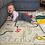 Klara a rejoint le concours — aidez-le/la à gagner de superbes lots ! baby, blanket, child, clothing, couch, cute, floor, foot, giraffe_toy, gray_pants, happy, home_interior, indoor, infant, playing, playmat, smiling, striped_shirt, toddler, toy