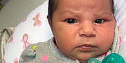 Rhaenyra joined the competition — help win amazing prizes! baby, infant, pacifier, polka_dots, pink_bows, grey_clothing, pillow, butterfly_pattern, closeup, face, serious_expression, newborn, indoors, blanket, cute, child, person, soft_fabric, resting, portrait