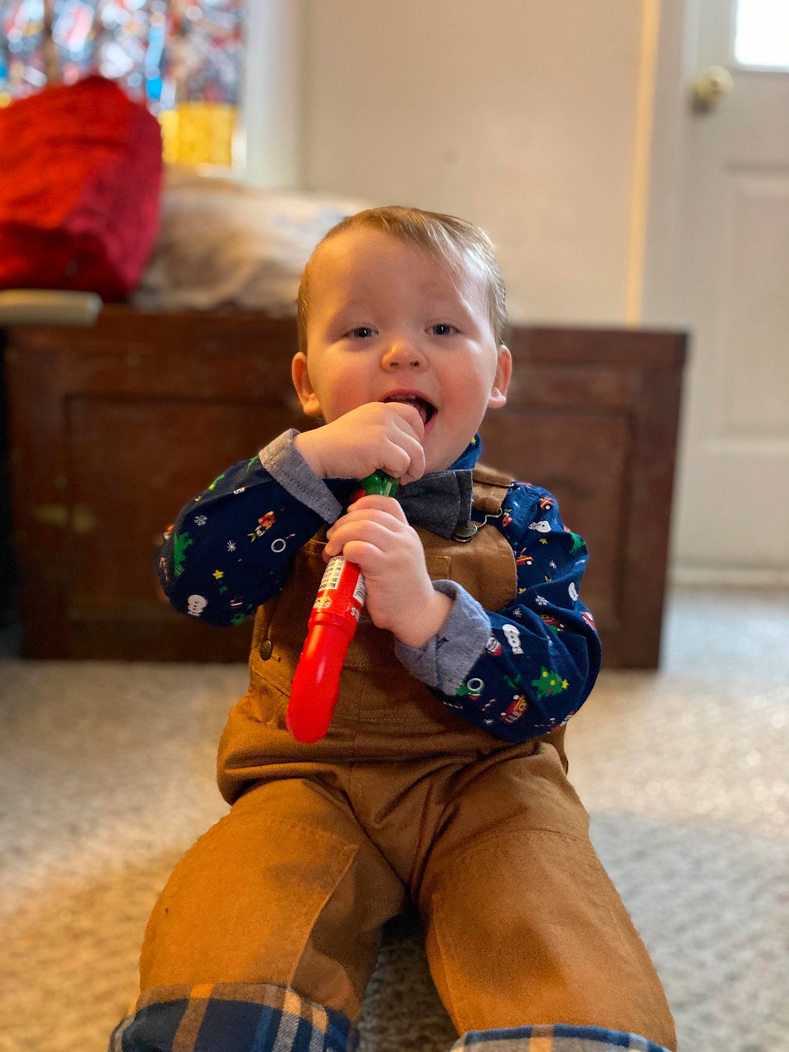 Calvin is registered to the contest to win money with this photo: baby, baby_toddler_clothing, cabinetry, cheek, child, comfort, event, eye, flooring, fun, head, human_body, knee, nose, person, sitting, skin, standing, thigh, toddler