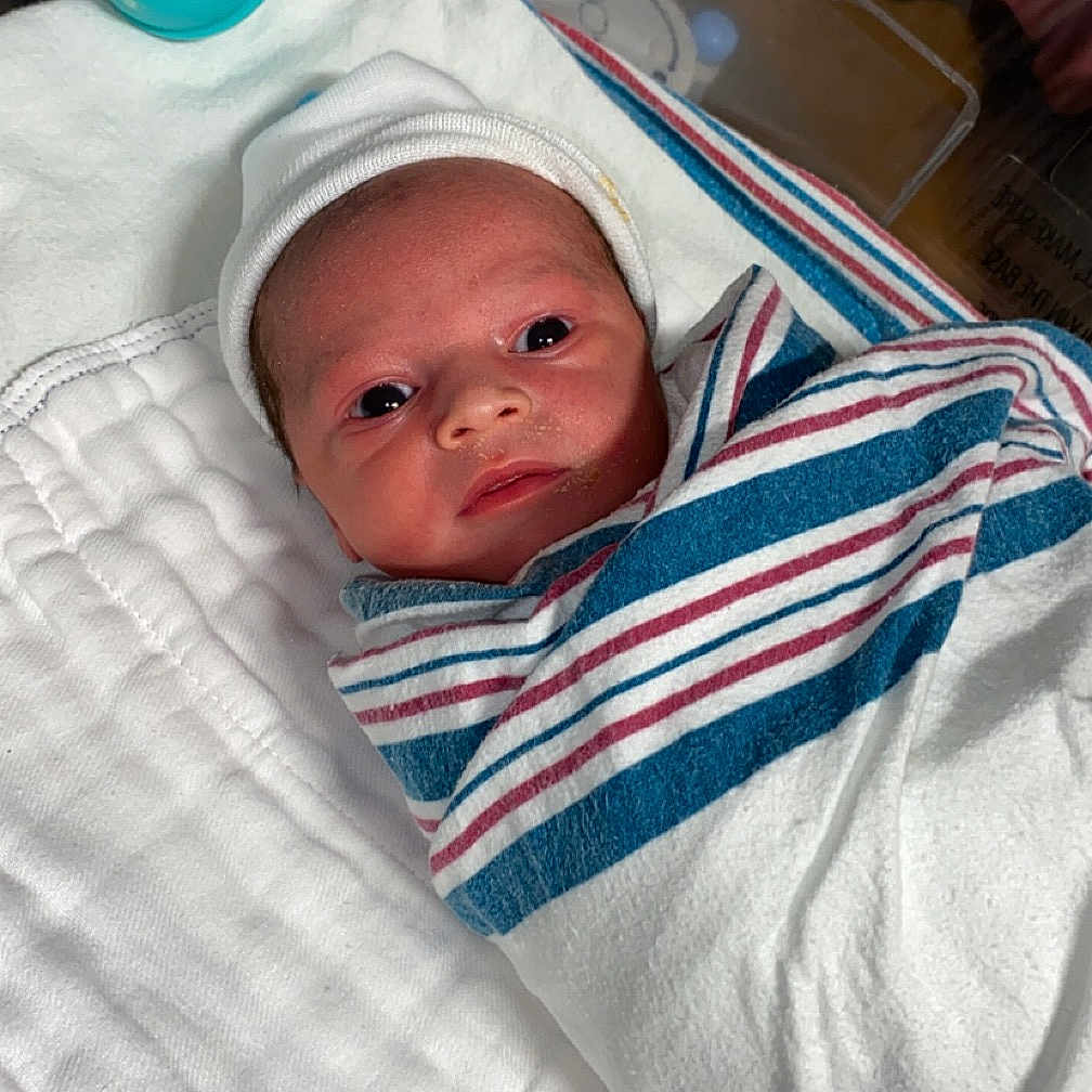 Davontae joined the competition — help win amazing prizes! architecture, baby, bed, bedroom, blanket, bonnet, building, clothing, cradle, crib, cushion, face, furniture, glove, hat, head, homedecor, hospital, indoors, infantbed