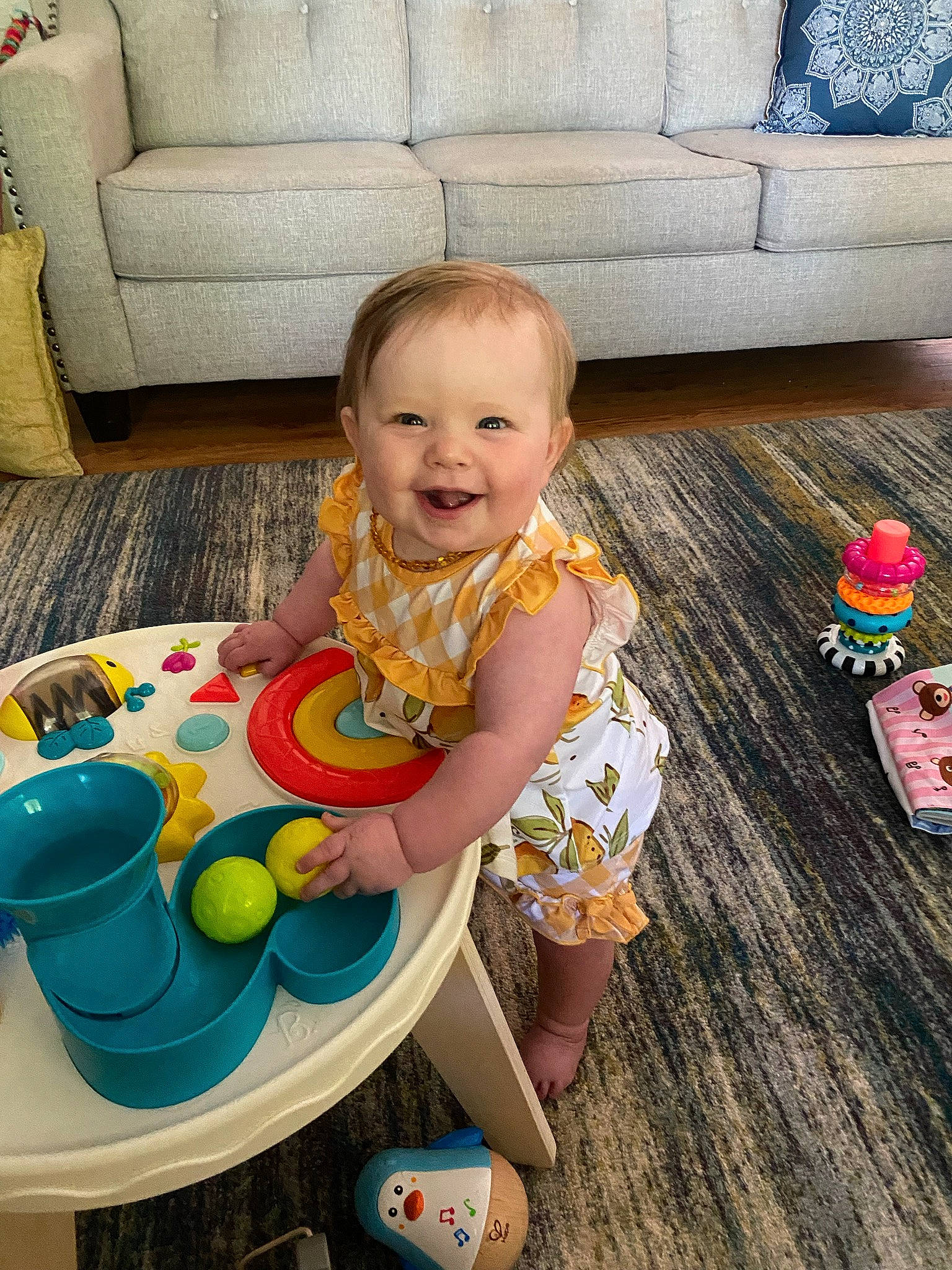 Juliette joined the competition — help win amazing prizes! baby, baby_toddler_clothing, baby_toys, chair, child, comfort, couch, flooring, fun, happy, hardwood, joy, leisure, living_room, person, play, sitting, smile, table, toddler