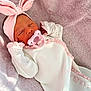 Aurora is registered to the contest to win money with this photo: baby, newborn, infant, pacifier, headband, bow, blanket, pink, soft_texture, sleeping, closed_eyes, onesie, ruffles, hands, cozy, portrait, fabric, nursery, cute, child