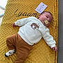 Lyaam a rejoint le concours — aidez-le/la à gagner de superbes lots ! baby, baby_boy, blanket, brown_pants, card, child, clothing, comfortable, cute, floor, indoors, infant, lying_down, name_embroidery, one_month, pacifier, peaceful, socks, soft_texture, white_sweater