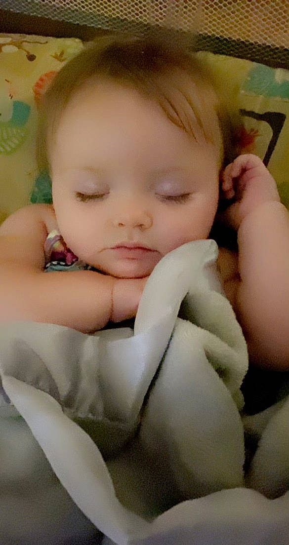 Blaklee is registered to the contest to win money with this photo: arm, baby, baby_toddler_clothing, cheek, comfort, eye, eyebrow, eyelash, face, finger, gesture, hand, happy, head, iris, lip, mouth, nose, person, skin