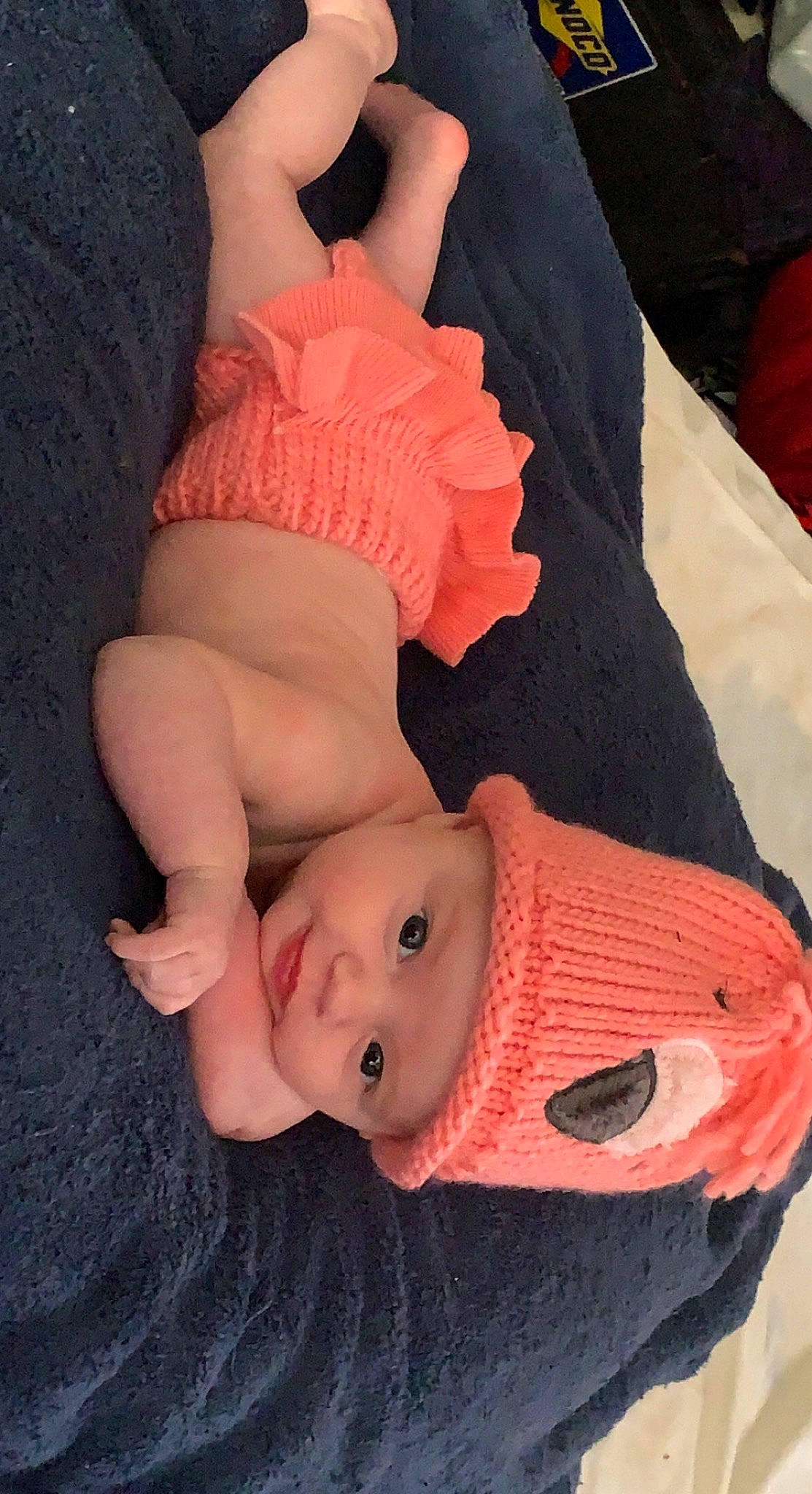 Kallie is registered to the contest to win money with this photo: baby, baby_toddler_clothing, cheek, chest, child, finger, gesture, happy, hat, head, headgear, headwear, lip, mouth, nose, person, pink, sleeve, smile, thumb