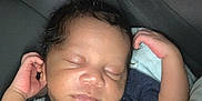 Amir joined the competition — help win amazing prizes! baby, sleeping, infant, car_seat, blanket, curly_hair, dinosaur_shirt, clothing, drool, peaceful, child, seatbelt, portrait, indoors, cute, young, resting, face, hand, cozy