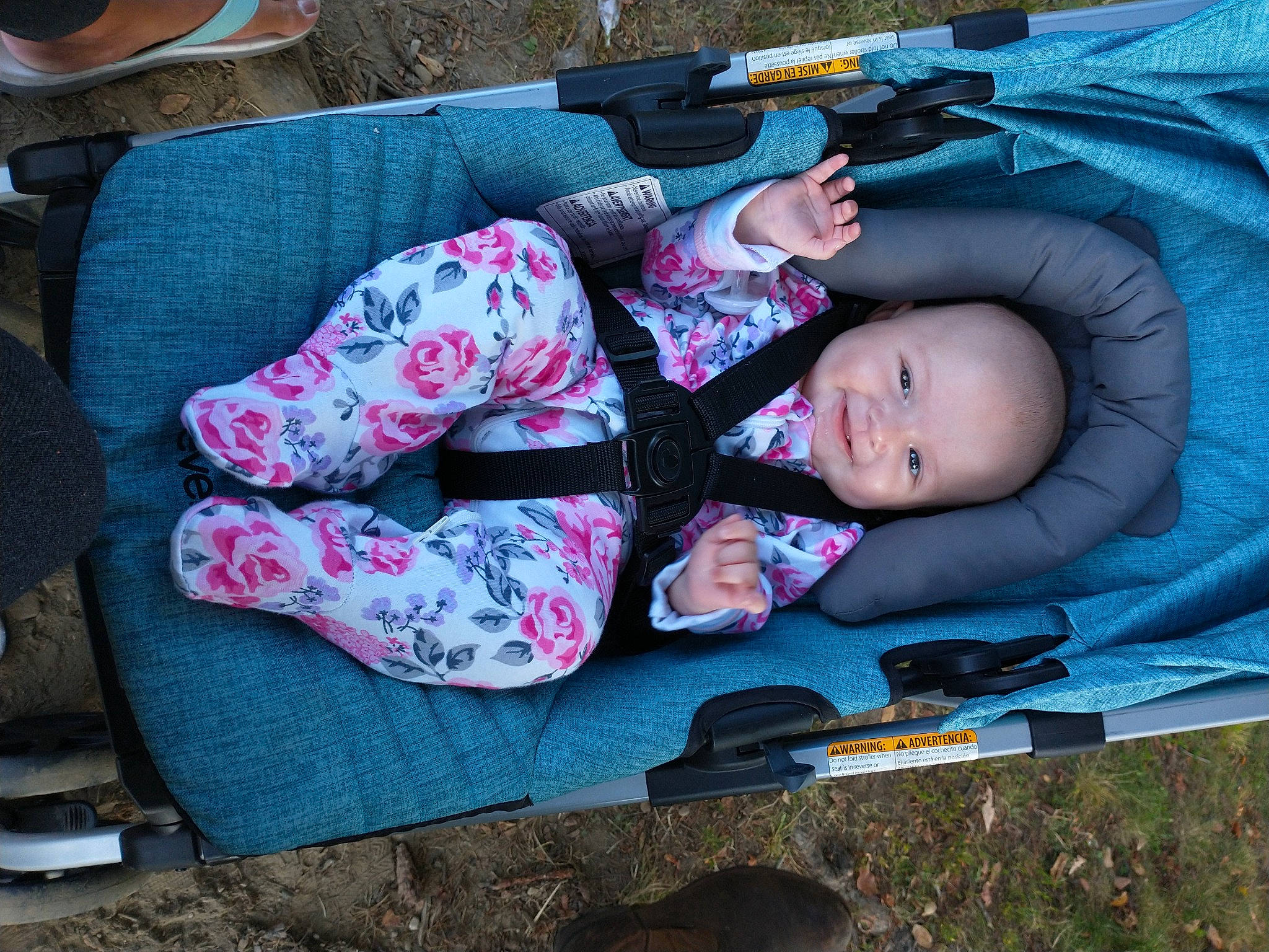 Faith joined the competition — help win amazing prizes! baby, baby_carriage, baby_products, baby_toddler_clothing, child, comfort, grass, hat, lap, leisure, nap, pattern, person, personal_protective_equipment, recreation, sitting, smile, suit, toddler, tree