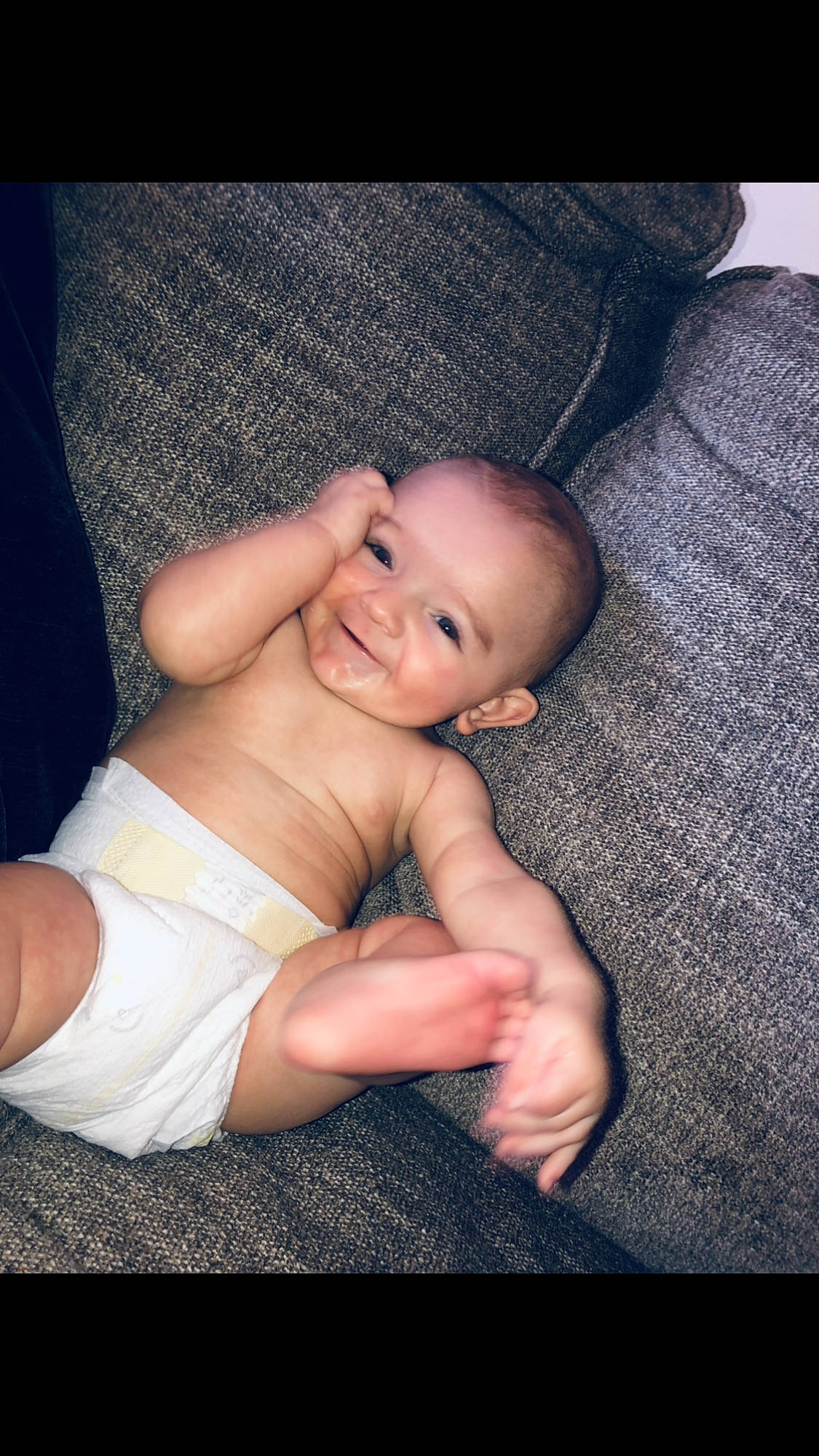 Cole is registered to the contest to win money with this photo: arm, baby, comfort, eye, eyebrow, face, finger, flash_photography, gesture, hand, happy, human_body, iris, joy, leg, lip, mouth, muscle, person, skin