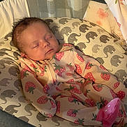 Timberlee joined the competition — help win amazing prizes! baby, newborn, sleeping, onesie, strawberry_pattern, baby_seat, elephant_print, cushion, infant, cozy, soft_lighting, cute, child, resting, indoors, fabric, pattern, sleep, person, wearing